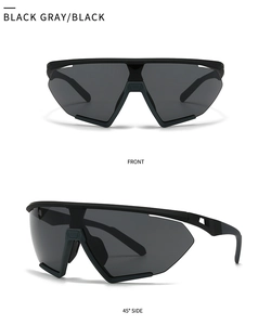 Close-up view of matte black oversized sports sunglasses with grey mono lens shield