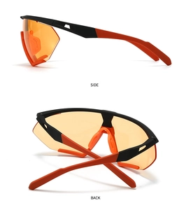 Detail view of sport sunglasses with orange semi-transparent lenses and black frames