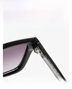 Macro shot of durable metal hinges and silver textured core on black frame sunglasses