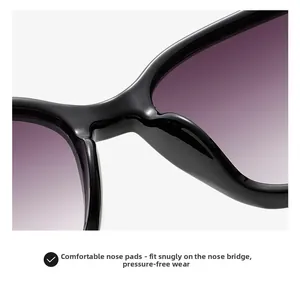 Detail of comfortable integrated nose pads and purple gradient lenses on black sunglasses