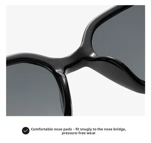 Close-up of comfortable integrated nose pads on glossy black square sunglasses