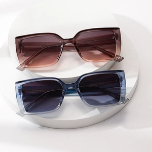 Fashionable oversized square sunglasses with gradient lenses and translucent frames