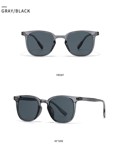 Detail view of square gray sunglasses with metal rivets and dark polarized lenses