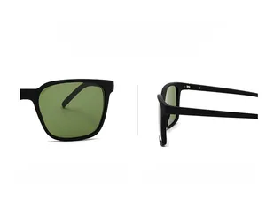Detail of square black frame sunglasses with dark green lenses and matte finish