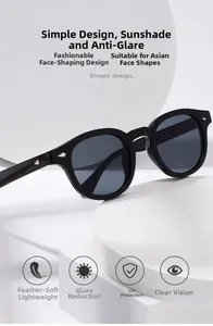 Close-up of black round sunglasses with silver diamond studs and UV protection lenses