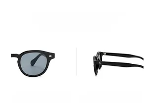 Detail of retro round sunglasses with black frames and silver diamond rivets