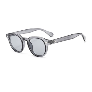 Retro round grey transparent sunglasses with vintage diamond rivets on the frame