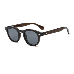 Vintage round tortoiseshell sunglasses with dark lenses and silver diamond accents