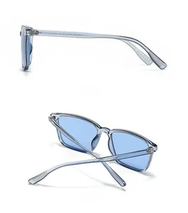 Detail view of modern retro square sunglasses showing grey transparent frame and blue lens