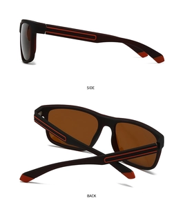 Détail de lunettes de soleil sport polarisées avec monture noire mate et bandes rouges