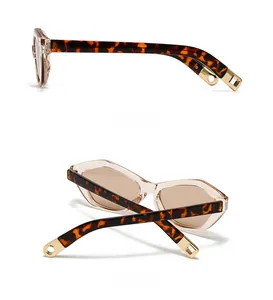 Detailed side and back view of cat eye sunglasses with tortoiseshell temple and gold accents