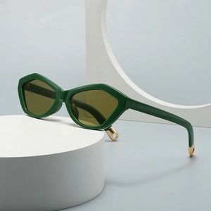 Modern retro cat-eye sunglasses with geometric green frames and metal accents