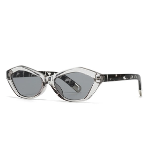 Modern cat-eye sunglasses with transparent angular frames and marble pattern temples
