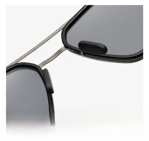 Macro shot of comfortable non-slip nose pads on slim metal retro sunglasses frame