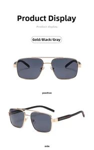 Détail de lunettes pilote en métal doré avec double pont et verres gris foncés