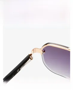 Macro view of gold metal hinges and purple gradient lenses on retro sunglasses
