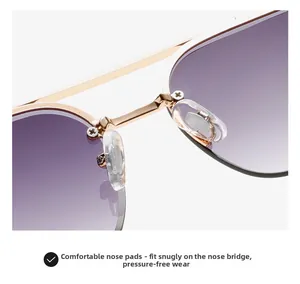 Detail of soft silicone nose pads on gold metal sunglasses with purple gradient lens