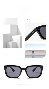 Detail view of black square sunglasses with silver diamond studs on the temples