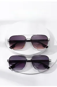 Detail of gradient sunglasses with dual beam silver metal frames on white display