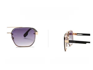 Detail of pilot sunglasses with purple gradient lenses and golden double bridge frame