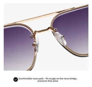 Detail of adjustable transparent nose pads on gold metal frame sunglasses with purple lenses
