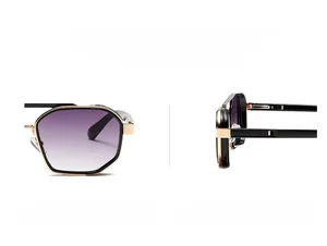 Close-up of polygonal black frames with gold metal edges and purple gradient lenses