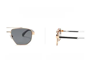 Detail of vintage sunglasses featuring gold double bridge and flexible spring hinges