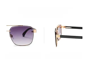 Detail of modern narrow frame sunglasses with purple gradient lenses and gold bridge