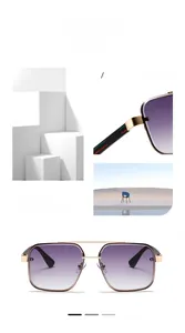 Detail view of gold metal temples with red and green stripes on gradient lens sunglasses