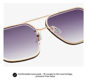 Close-up of adjustable silicone nose pads and golden metal frame on gradient sunglasses