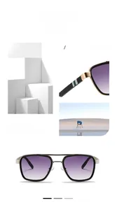 Detail of retro pilot sunglasses with purple gradient lenses and gold metal temples