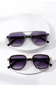Detail of vintage square metal sunglasses with double bridge and purple gradient lenses