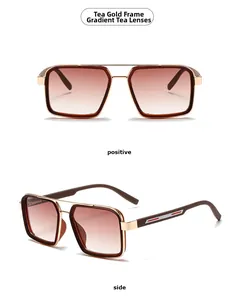 Detail of square gold metal frame sunglasses with gradient brown lenses and side stripes