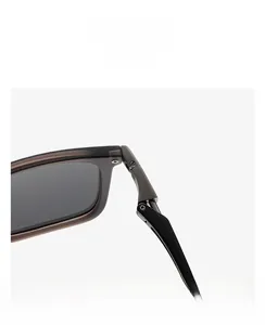 Macro shot of durable metal hinge on translucent brown frames of premium sunglasses
