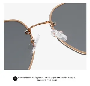 Detail of comfortable silicone nose pads on champagne gold metal sunglasses frame