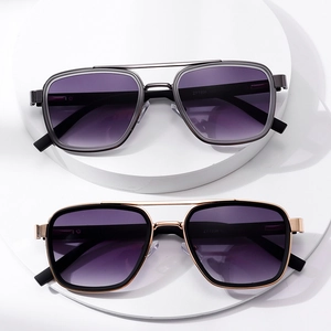 Retro pilot sunglasses with gold and silver metal frames and purple gradient lenses