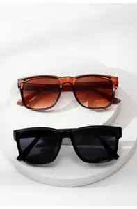 Detailed display of square sunglasses in brown gradient and classic black colors