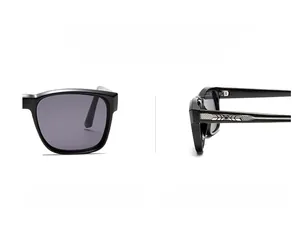 Detail of square black sunglasses with silver geometric texture on the temple