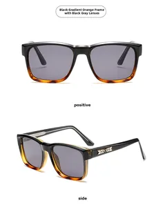 Detail view of square black to orange gradient sunglasses with gold arrow accent