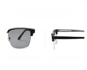 Detail view of square half-rim sunglasses with black frame and grey sun lenses