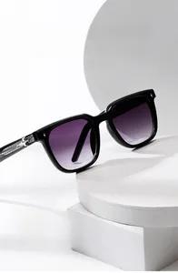 Detail of square sunglasses with purple gradient lenses and silver star temple accents