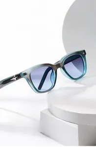 Detail of square frosted grey sunglasses with gradient purple lenses and star metal hinge
