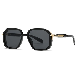 Lunettes de soleil pilote noires à monture carrée avec des accents dorés sur les branches