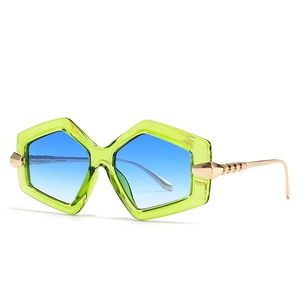 Fashionable oversized square sunglasses with translucent green frame and blue gradient lens