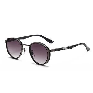Modern retro round sunglasses with gradient purple lenses and carbon fiber temple detail