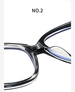 Macro shot of stylish black large frame eyeglass bridge and smooth acetate nose pads