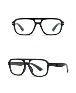Vue avant et latérale de lunettes de soleil noires à dessus plat de style pilote