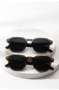 Modern polarized sunglasses with translucent frames and metallic temple details