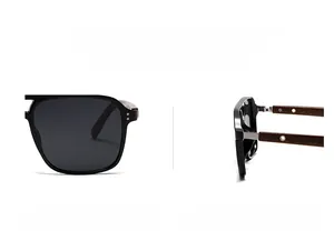 Detail view of round polarized sunglasses with dark lenses and brown wood grain temples