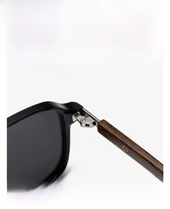 Detailed close-up of premium wood texture temples and durable metal hinges on sunglasses